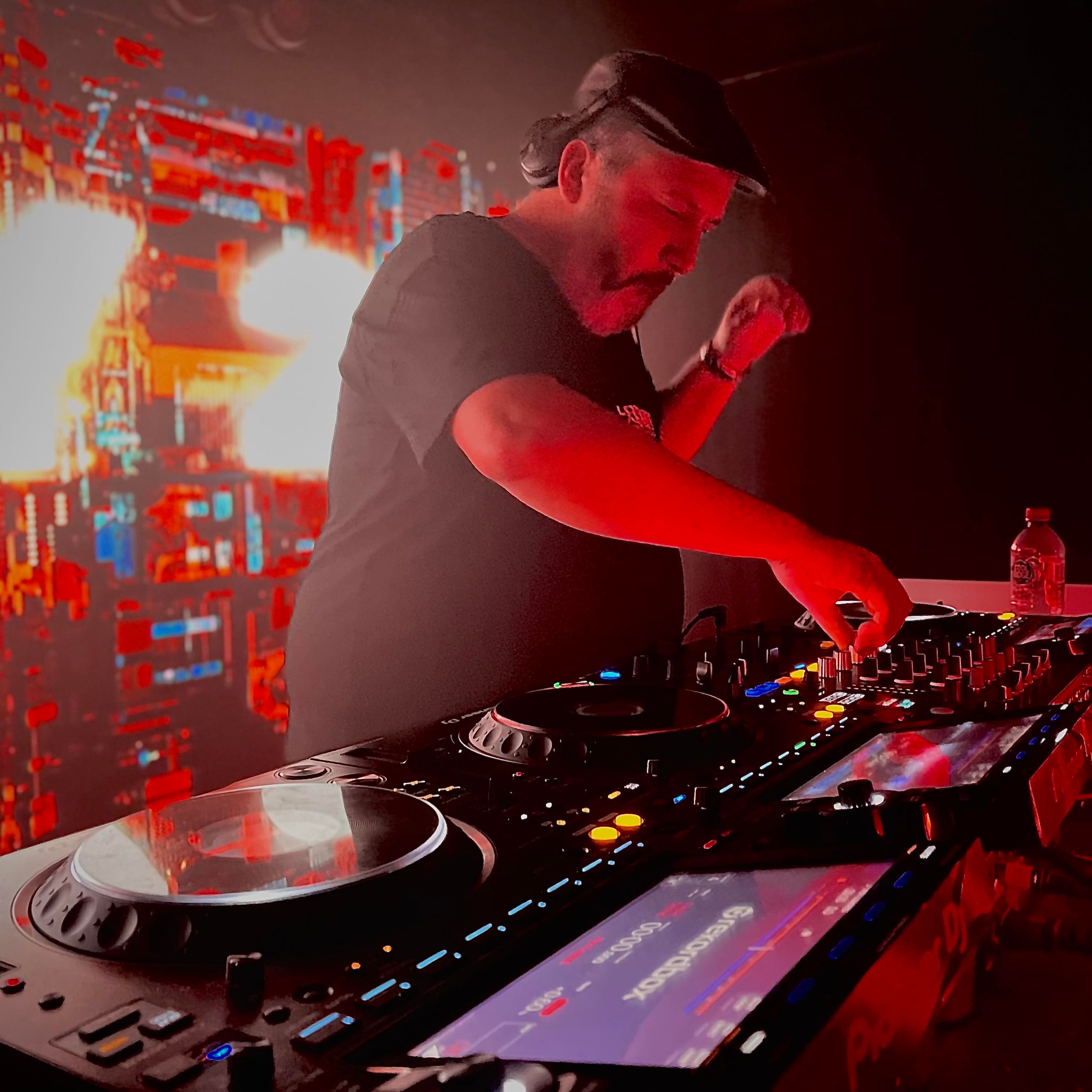 Wedding DJ playing electronic music to a packed dancefloor at a Sunshine Coast reception